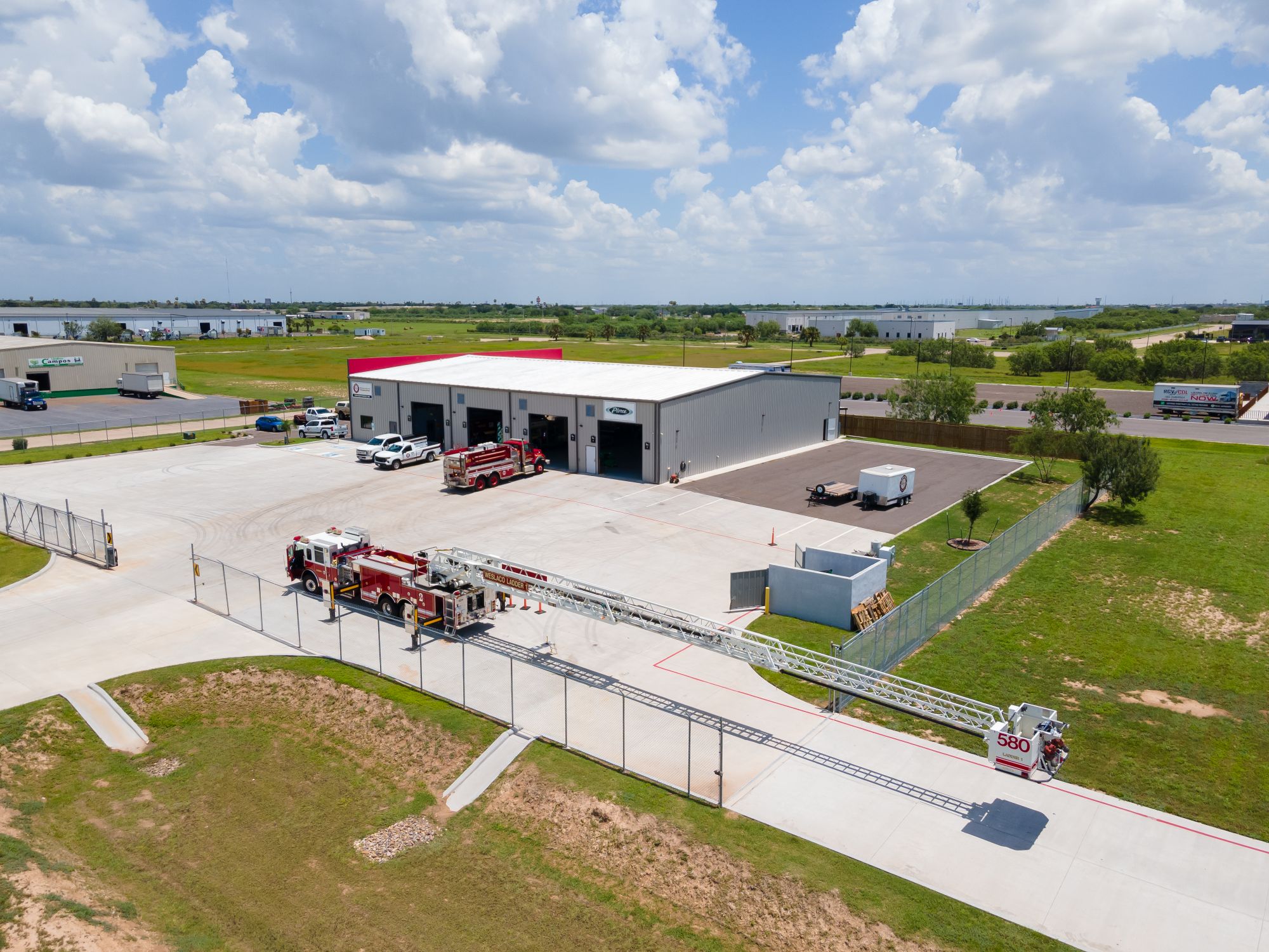 Aerial view of a Pierce fire apparatus facility with a ladder truck at the Edinburg North Industrial Park
